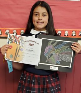 student with art award
